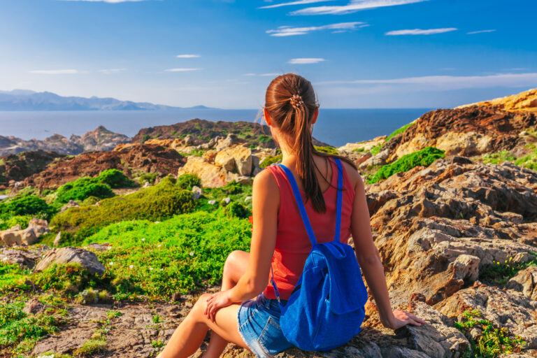 Tourist,Woman,With,Backpack,On,Cap,De,Creus,,Natural,Park.