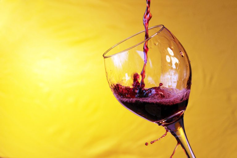 Red,Wine,Pours,Into,,Onto,,And,Around,A,Wine,Glass