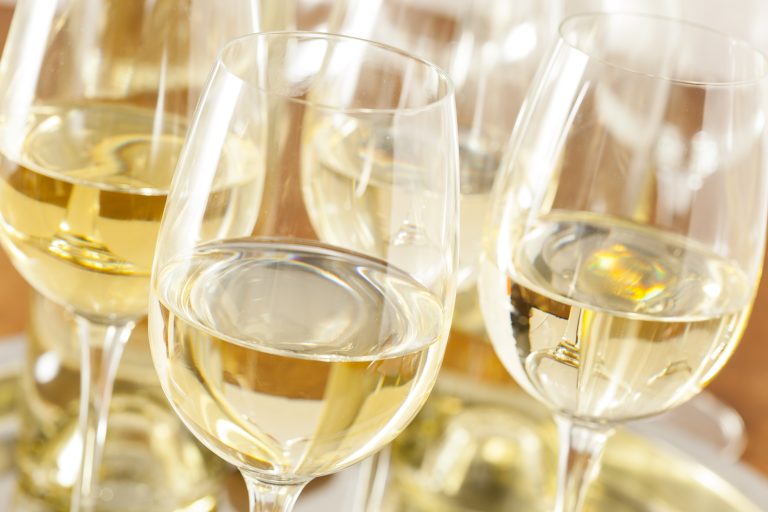 Refreshing,White,Wine,In,A,Glass,On,A,Background