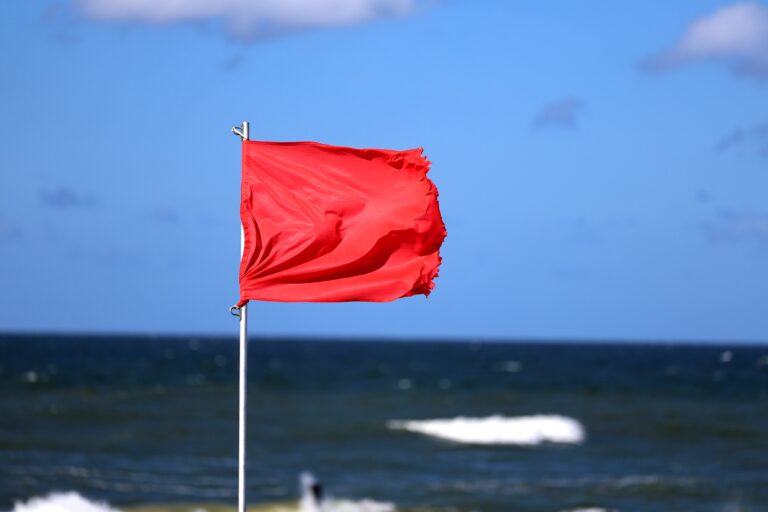 08.17.2024,Wroclaw,,Poland,,Red,Flag,On,The,Beach,Prohibiting,Swimming